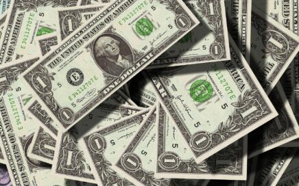 picture of a pile of dollar bills courtesy Pixabay