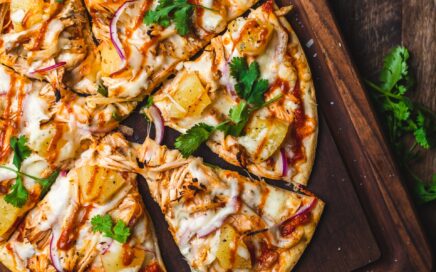 Photo of a home-made pizza on a chopping block