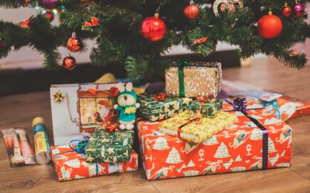 Photo of presents under a tree by Eugene Zhyvchik on Unsplash
