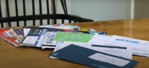 A pile of paper strewn over a table