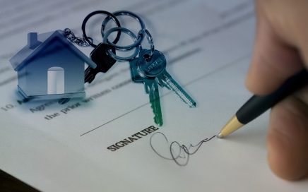 Photo of document being signed with a set of keys laying on the document courtesy Pixabay