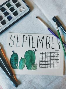 Photo of the word September in watercolor by Saundarya Srinivasan on Unsplash