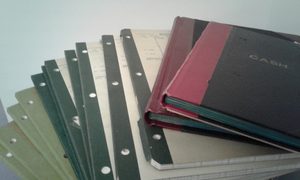 Photo of a stack of accounting spreadsheet books